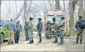  ?? ANI PHOTO ?? ■ Army personnel stand guard near the site of encounter with the terrorists in Tral on Saturday.