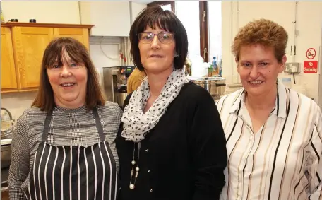  ??  ?? Julie Gaffney, Deirdre Flynn and Susan Delaney helping out in the kitchen at the annual community dinner hosted by Arklow Community Action Resource Centre in Arus Lorcáin.