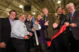  ?? PHOTOS BY BARRY GRAY, THE HAMILTON SPECTATOR ?? Pierre Riel of Costco, second from left, joined local politician­s including Mayor Fred Eisenberge­r for the opening.