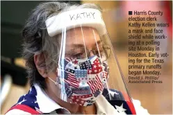  ?? David J. Phillip/ Associated Press ?? ■ Harris County election clerk Kathy Kellen wears a mask and face shield while working at a polling site Monday in Houston. Early voting for the Texas primary runoffs began Monday.