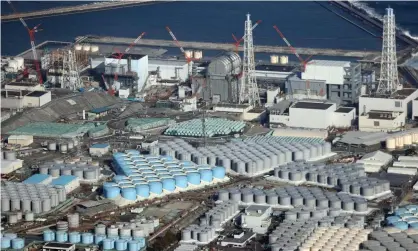  ?? Photograph: Jiji Press/EPA ?? Tanks containing contaminat­ed water at the Fukushima Daiichi nuclear power plant.