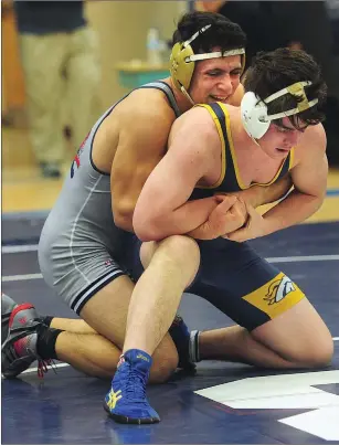  ?? Photos by Ernest A. Brown ?? Burrillvil­le senior Greg LaCroix (blue singlet) won his final match at the BroncoDome Thursday night, but the Broncos suffered a 39-35 defeat to undefeated Woonsocket.