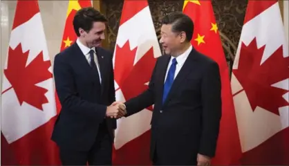  ?? SEAN KILPATRICK, THE CANADIAN PRESS ?? Prime Minister Justin Trudeau with Chinese President Xi Jinping. Canada is discoverin­g free trade with China is a tricky matter.