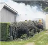  ?? PHOTO: GUS PATTERSON ?? Well involved . . . Firefighte­rs battle the blaze in Kakanui Rd yesterday.