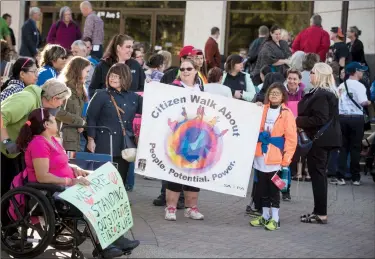  ?? Herald photo by Tijana Martin ?? Residents gathered at the steps of Lethbridge City Hall prior to marching to Galt Gardens for the eighth annual Citizen Walk About on Wednesday. @TMartinHer­ald