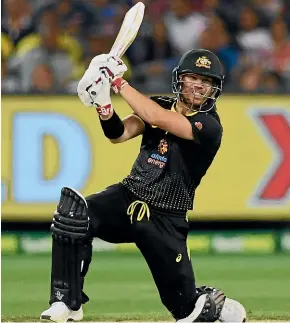  ?? GETTY IMAGES ?? Australian opener David Warner hits out at the Melbourne Cricket Ground on Friday night.