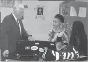  ??  ?? Congressma­n Steny Hoyer speaks with Thomas Stone High School’s Project Lead the Way Biomedical students Teyonna Harley and Zion Huntley.