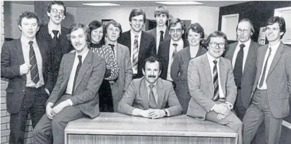  ?? ?? Tom Flockhart, seated, with his team in the early days of Capital Copiers in Edinburgh, where the company had been launched in 1979.