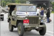  ?? PHOTO BY ANITA GARNETT ?? A jeep in the Memorial Day parade on Monday reminded residents to honor Dube.