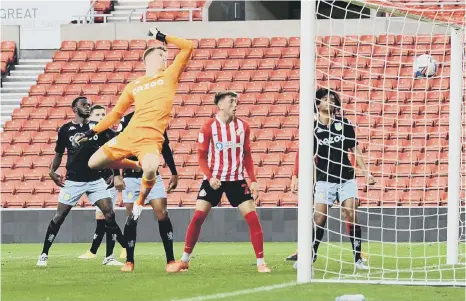  ??  ?? Morgan Feeney, not shown, sees his effort hit the back of the net.