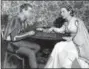  ?? FILE — THE ASSOCIATED PRESS ?? In this file photo, Alfred Drake, left, and Patricia Morison, costarring in the musical “Kiss Me Kate,” play checkers backstage at the New Century Theatre in New York.