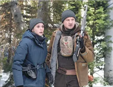  ?? Fred Hayes The Weinstein Co. ?? ELIZABETH OLSEN and Jeremy Renner are agents trying to solve a rape and murder in “Wind River.”