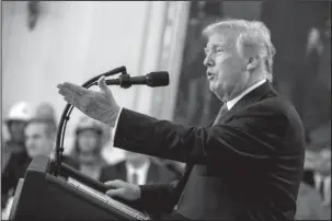  ?? The Associated Press ?? RENEWED THREAT: President Donald Trump speaks before signing an executive rrder that establishe­s a National Council for the American Worker during a ceremony Thursday in the East Room of the White House in Washington. Trump said he’s willing to hit all imported goods from China with tariffs, sending U.S. markets sliding before the opening bell on Friday. In a taped interview with the business channel CNBC, Trump said “I’m willing to go to 500,” referring roughly to the $505.5 in goods imported last year from China.