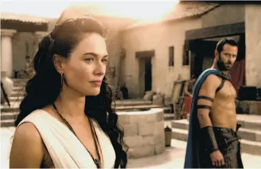  ?? Photos by Warner Bros. Pictures ?? Lena Headey reprises her role as Sparta’s Queen Gorgo and Sullivan Stapleton portrays an Athenian general, Themistokl­es, in the new film “300: Rise of an Empire.”