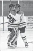  ?? TINA COMEAU ?? A hug to celebrate the gold-medal win.