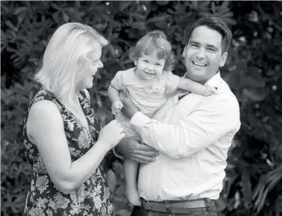  ??  ?? Simon Bridges with his wife Natalie Bridges and their daughter Jemima, at home in Tauranga.