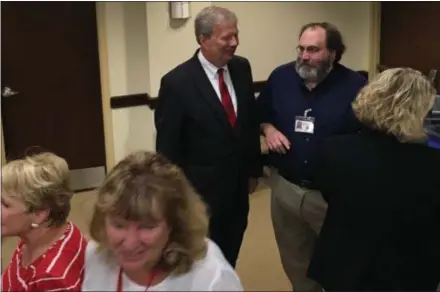  ?? MICHAEL P. RELLAHAN — DIGITAL FIRST MEDIA ?? The line of those waiting to say goodbye and good luck to Mark Rupsis, outgoing Chester County chief operating officer, in foreground.