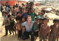  ??  ?? Nurse Elizabeth gilmore with some of the refugee children.