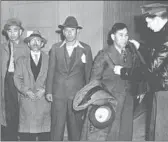  ?? Los Angeles Public Librar y Herald Examiner collection
FOUR JAPANESE ?? men are processed before being sent to the Tuna Canyon center in 1942.