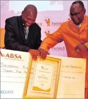  ??  ?? MUSIC MAKER: PanSALB recognised Bangani Skhosana for his music that promotes iSwati. Handing over the award is Rakwena Monareng.