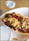  ?? PHOTOS BY MONICA RODMAN ?? Chipotle quesadilla with fajita veggies.