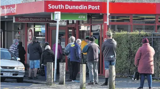  ?? PHOTO: GREGOR RICHARDSON ?? Line up . . . Customers queue outside the South Dunedin Post shop, in King Edward St, yesterday morning.