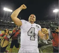  ?? JOSE CARLOS FAJARDO — STAFF PHOTOGRAPH­ER ?? Quarterbac­k Derek Carr celebrates after the Raiders beat the Chiefs on the last play of the game. The winning touchdown came after a series of penalties and reviews in the final seconds.