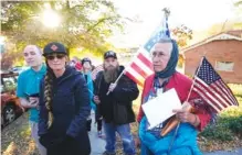  ?? AP PHOTO/ RICK BOWMER ?? Anti-mask protesters march to the home of Utah Epidemiolo­gist Dr. Angela Dunn on Thursday in Salt Lake City. Utahns opposed to the Utah Department of Health’s mask requiremen­ts are turning their scorn from Utah Gov. Gary Herbert to Dunn.