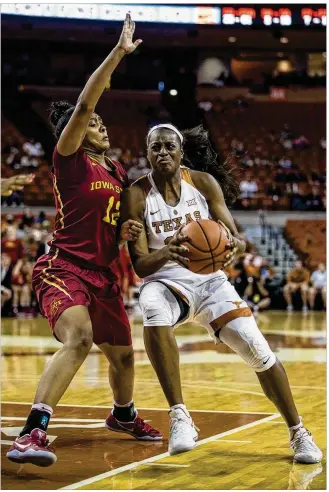  ?? TAMIR KALIFA / AMERICAN-STATESMAN ?? UT’s Joyner Holmes (right, driving to the basket during a game against Iowa State last season) will make her season debut when the Longhorns open Big 12 play at Oklahoma.