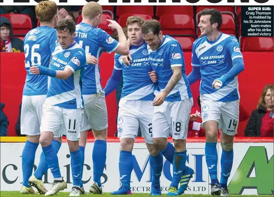  ??  ?? SUPER SUB: Craig Thomson is mobbed by his St Johnstone team-mates after his strike sealed victory