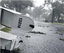  ?? SENTINEL FILE
SOUTH FLORIDA SUN ?? Strong winds and rain from Hurricane Irma down trees, branches and mail boxes at Monarch Lakes in West Miramar in 2017.