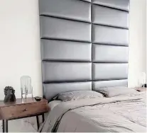  ?? VANTPANELS.COM ?? A headboard helps anchor a bed while adding comfort to the room. Make sure to include a bed skirt, pillows and cosy flannel bedding with a touch of holiday cheer to round out the look.