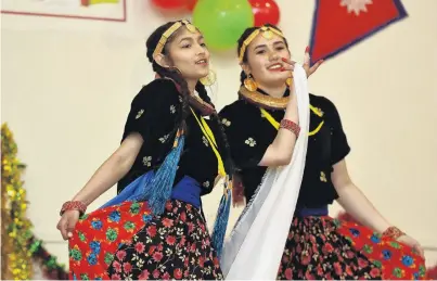  ?? PHOTO: GREGOR RICHARDSON ?? Cultural celebratio­n . . . Nepalese dance performers Bandana Regmi (left) and Tupten Tamang (both 17) at Burns Hall, First Church of Otago.