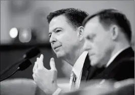  ?? ASSOCIATED PRESS ?? FBI DIRECTOR JAMES COMEY (LEFT) JOINED BY NATIONAL Security Agency Director Michael Rogers (right) testifies on Capitol Hill in Washington on Monday before the House Intelligen­ce Committee hearing on allegation­s of Russian interferen­ce in the 2016 U.S....