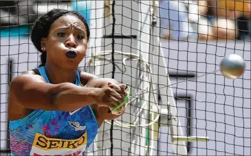  ?? SHIZUO KAMBAYASHI / AP ?? Gwen Berry was placed on probation for raising her fist during the national anthem at the Pan-Am Games. The U.S. Olympic and Paralympic Committee posted after George Floyd’s death it “stands with those who demand equality.”