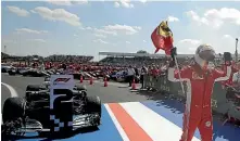  ?? AP ?? Sebastian Vettel celebrates after winning the British Grand Prix.