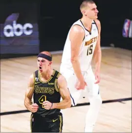  ?? Mark J. Terrill Associated Press ?? LAKERS GUARD Alex Caruso celebrates in front of the Nuggets’ Nikola Jokic. “We know what we’re going to get out of him,” LeBron James said of Caruso.