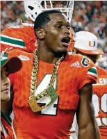  ?? LYNNE SLADKY / ASSOCIATED PRESS ?? Miami defensive back Jaquan Johnson wears the turnover chain after a fifirst-half intercepti­on during the Nov. 11 home victory over Notre Dame.