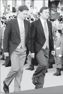  ?? Pascal Le Segretain Getty Images ?? XAVIER BETTEL, right, and partner Gauthier Destenay attend a 2012 royal wedding in Luxembourg. A new law on gay marriage will enable Bettel, now premier, and Destenay to wed.