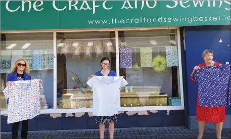  ??  ?? Cllr Marie Casserly , Mary Durcan of Craft and Sewing Basket and Anne Feehily with the scrubs they are making and distributi­ng.