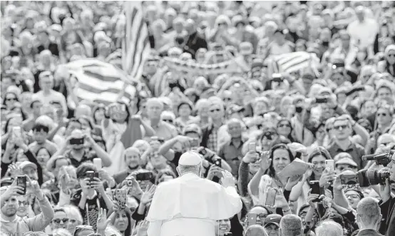  ?? Andrew Medichini photos / Associated Press ?? Pope Francis arrives for his weekly general audience in St. Peter's Square at the Vatican this past week.