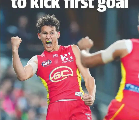  ?? Picture: GETTY IMAGES ?? Suns teenager Wil Powell celebrates his goal, which was also the first of his AFL career.