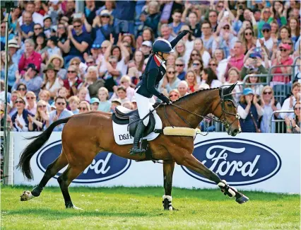  ?? Picture: Steve Parsons/PA ?? Laura Collett, on London 52, celebrates victory at the Badminton Horse Trials