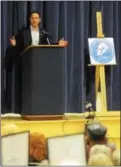  ??  ?? Left, Montgomery County Commission­er Josh Shapiro was the keynote speaker during the Chester County Democrats convention on Saturday. Above, Manan Trivedi (third from right) stands in the back of the room during the convention held at Fugett Middle...