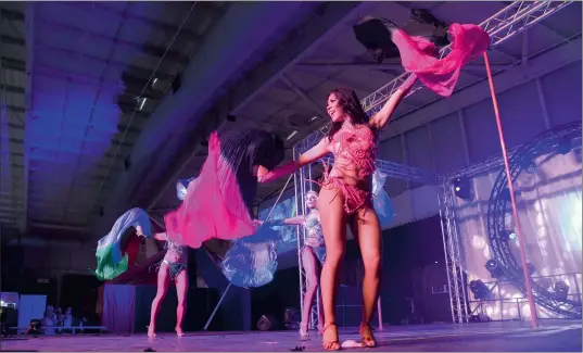  ?? PICTURE: NOKUTHULA MBATHA ?? CARNIVAL FEVER: Like moths to a flame, the main stage at the health, sexuality and lifestyle Sexpo at Gallagher Convention Centre drew a huge crowd with performers showing a plethora of innovation, from exotic dancers in skimpy-sequinned costumes...