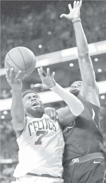  ?? ASSOCIATED PRESS ?? Boston Celtics guard Jaylen Brown (7) goes to the basket against Cleveland Cavaliers forward LeBron James (23) during the third quarter of Game 5 of the NBA basketball Eastern Conference finals in Boston.