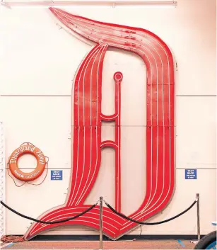  ?? EMILY BERL PHOTOS THE NEW YORK TIMES ?? Richard Kraft’s collection includes a refurbishe­d five-metre neon “D” from the Disneyland Hotel.