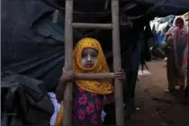  ?? MAHESH KUMAR A., THE ASSOCIATED PRESS ?? Rohingya Muslim girl Yasmin Ara stands in front of her shanty at a camp for refugees in Hyderabad, Monday. Thousands have fled Myanmar’s violence.