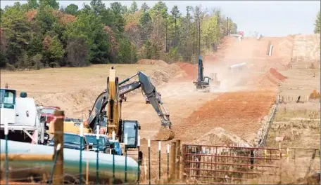  ?? Sarah A. Miller Tyler Morning Teleg raph ?? CREWS WORK on a Texas section of pipeline in 2012. The Keystone XL project would connect to lines reaching Gulf of Mexico refineries.