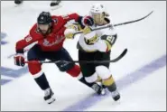  ?? PABLO MARTINEZ MONSIVAIS — THE ASSOCIATED PRESS ?? Washington Capitals forward Chandler Stephenson (18) contends with Vegas Golden Knights forward Cody Eakin (21) during the third period in Game 3 of the NHL hockey Stanley Cup Final, Saturday in Washington.